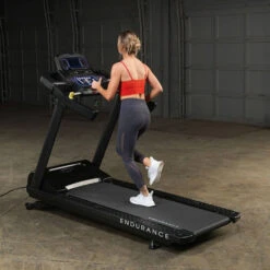 Body-Solid Endurance Commercial Treadmill T150 15 Body-Solid Endurance Commercial Treadmill T150 -Fitness Equipment Sales Body Solid T150 Commercial Treadmill Back Side View Female Model