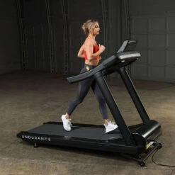 Body-Solid Endurance Commercial Treadmill T150 14 Body-Solid Endurance Commercial Treadmill T150 -Fitness Equipment Sales Body Solid T150 Commercial Treadmill Side View Female Model