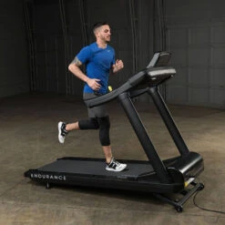 Body-Solid Endurance Commercial Treadmill T150 13 Body-Solid Endurance Commercial Treadmill T150 -Fitness Equipment Sales Body Solid T150 Commercial Treadmill Side View Male Model